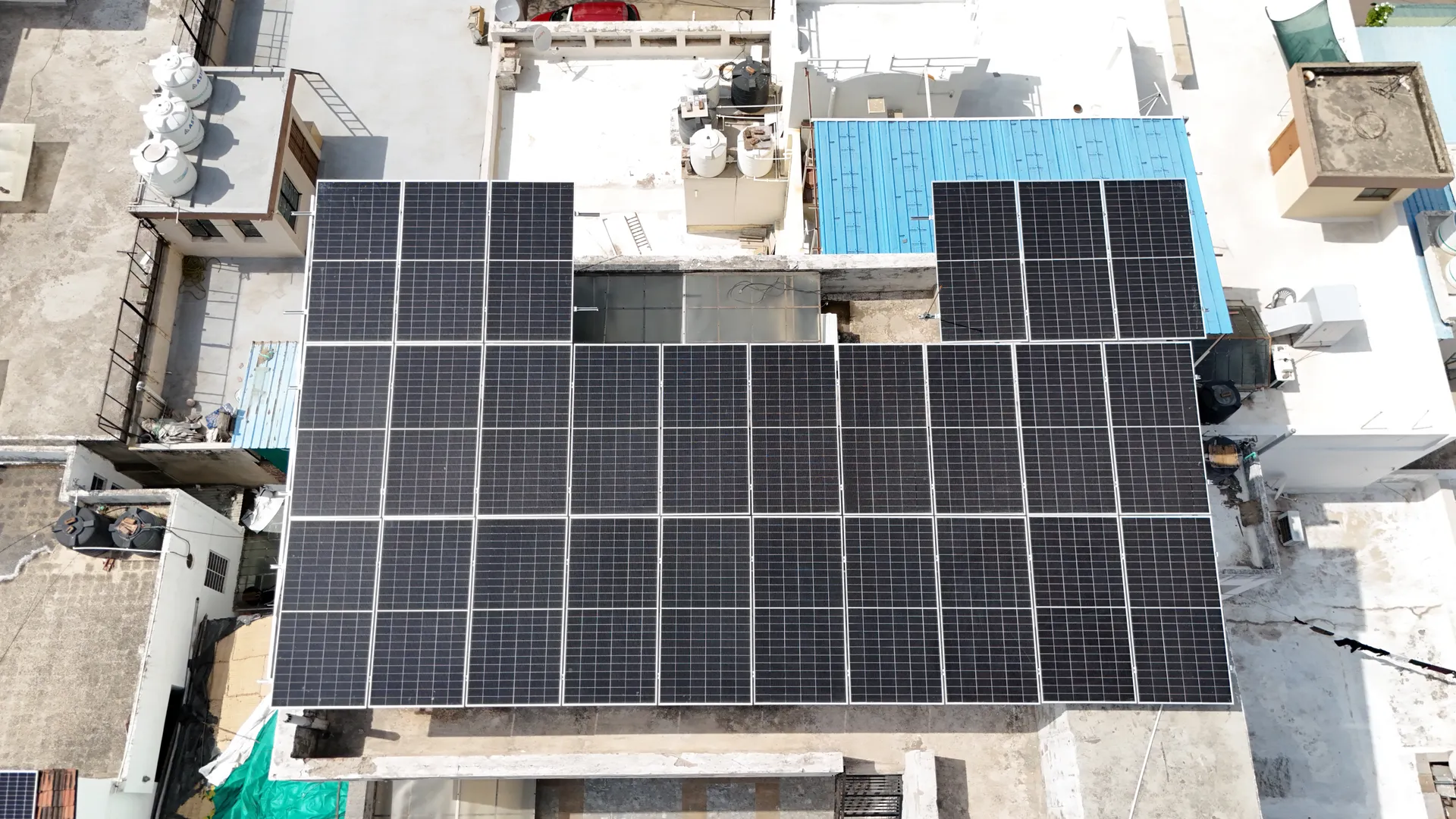 Aerial view of residential rooftops with solar in Kota